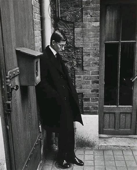 Yves Saint Laurent attending the funeral of his mentor, Christian Dior .